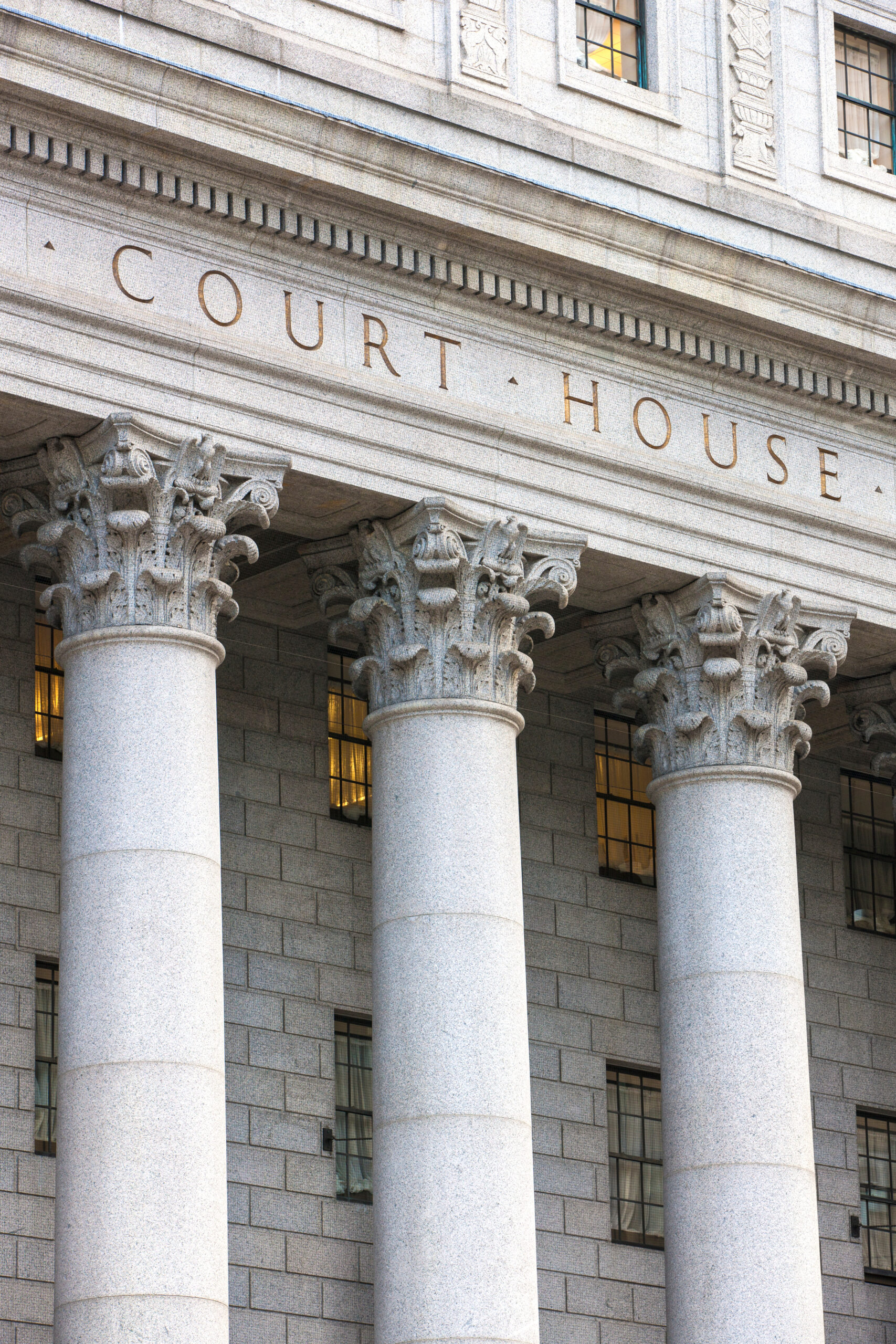 Facade of federal courthouse with towering columns. img-26